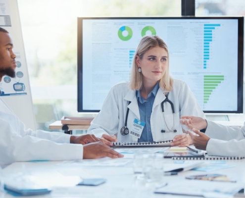 Medical professionals looking at data in meeting